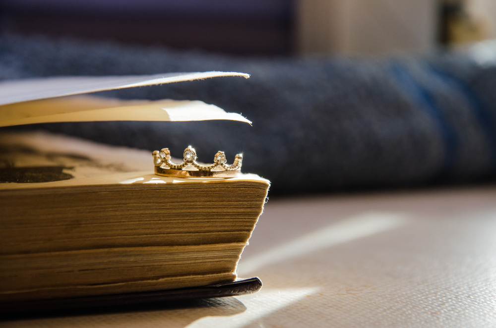 A small golden crown inside an RPG book